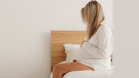 kaboompics_pregnant-woman-in-a-white-robe-sitting-on-a-bed-35849 (1).jpg