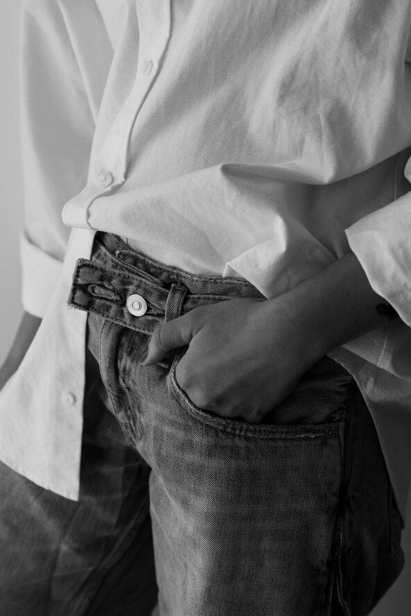 kaboompics_hand-in-denim-pocket-with-white-shirt-in-black-and-white-43478 (1).jpg